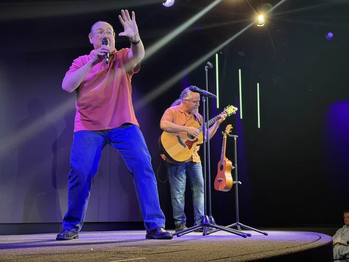 James and Rob performing on stage.