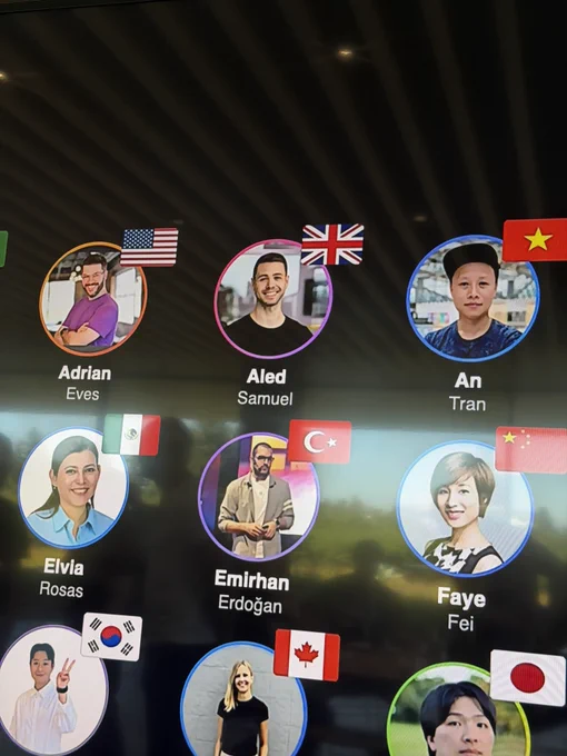 Photo of a few community leaders on the monitor, with Aled’s face visible.