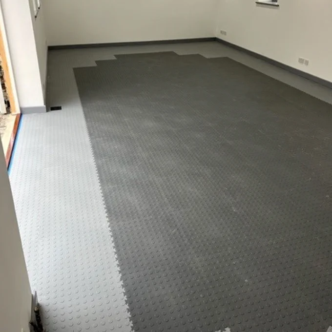 These Light Grey Recycled CoinTop - MotoLock Interlocking Floor Tile can be laid quickly and easily on any reasonably smooth and level concrete base creating ready-for-use, dust-free, anti-skid surfaces and can be easily cleaned with a brush and sponge floor mop. The tiles simply snap together. No nails or glue are required, which means your floor can be easily transferred or reused again. Give your flooring a fresh and modern feel.