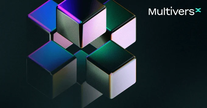 A cluster of stylized, reflective cubes in various colors on a dark background, representing digital technology or innovation.