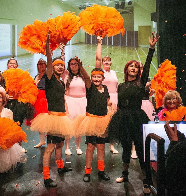 TS on stage with orange fans