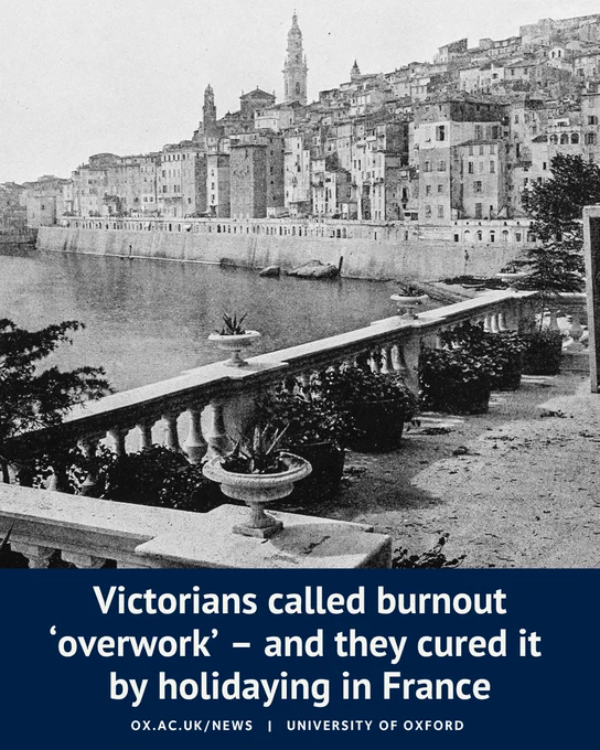 Historic black-and-white photograph of Menton on the French Riviera, showing a waterfront lined with tightly packed buildings rising up a hillside. In the foreground, a terrace overlooks the sea. Overlaid text reads: “Victorians called burnout ‘overwork’ – and they cured it by holidaying in France”. University of Oxford branding appears at the bottom.