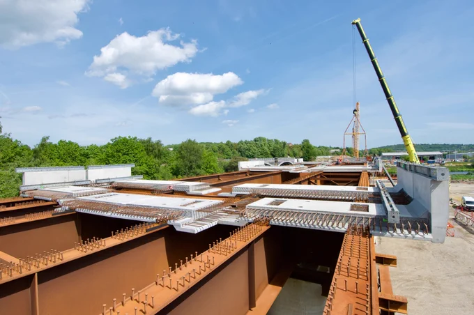 Baker Viaduct looking east towards Dewsbury and Leeds as the first of 360 pre-cast concrete deck panels are installed. The Grade 2-listed iron cast bridge (background) will no longer be used once the viaduct opens. PHILIP HAIGH.
