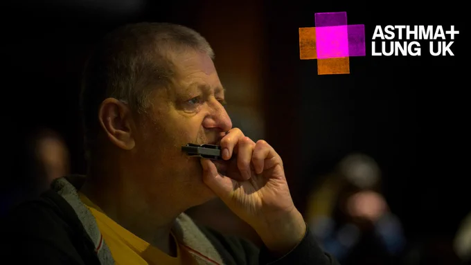 Man playing the harmonica
