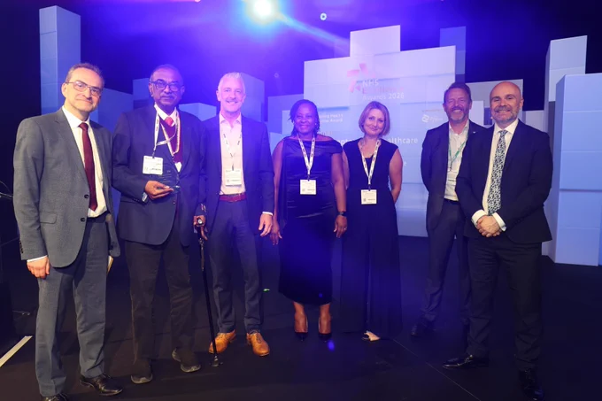 East Midlands Child and Adolescent Mental Health Services (CAMHS) Collaborative picking up their award for Improving Health Outcomes from Duncan Burton, Chief Nursing Officer for England.