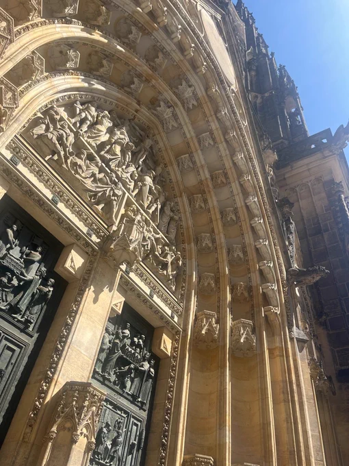 Reliefs over the door on the facade of St Vitus’ Cathedral in Prague