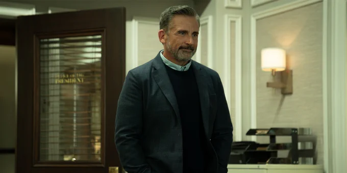 Steve Carell stood in a blazer and jumper