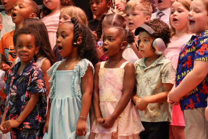 students sing in a group during a kindergarten concert