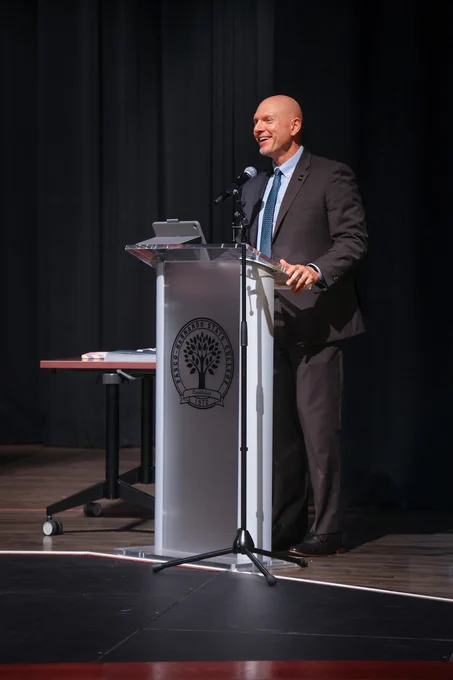 Eric Hall speaking during ceremony.