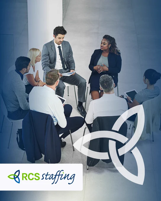 A diverse group of professionals engaged in a collaborative meeting in a modern office setting, fostering a sense of teamwork and communication.