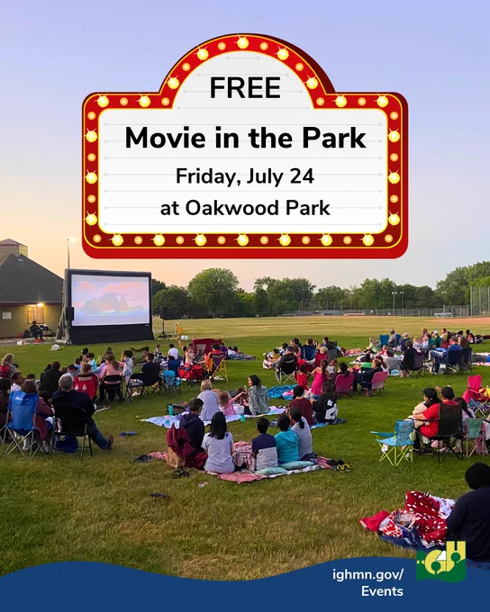 Families and friends seated on blankets and chairs watching a free outdoor movie at Oakwood Park during sunset. Free Movie in the Park will be at Oakwood Park on Friday, July 24.