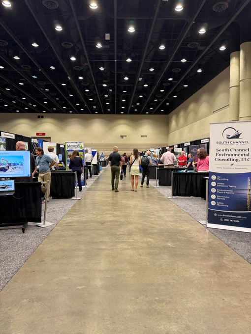 Attendees visit exhibit booths.