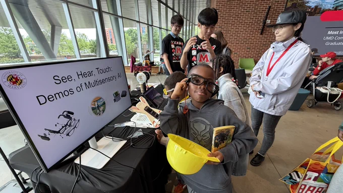 Kids at Maryland Day 2026 learn about SonoWorld. Photo courtesy Ruohan Gao.