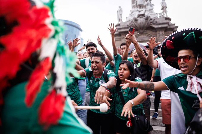 A photo of Mexico fans singing in Mexico City.
