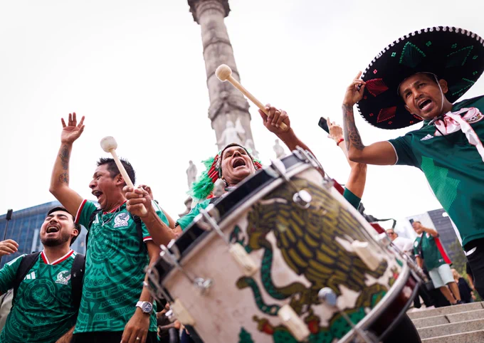 A photo of Mexico fans singing in Mexico City.
