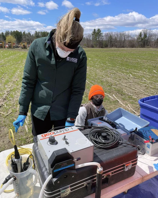 USGS scientists sampling groundwater near the top of the water table in a corn field in Concord, New Hampshire. Photo by Joseph Ayotte, USGS.