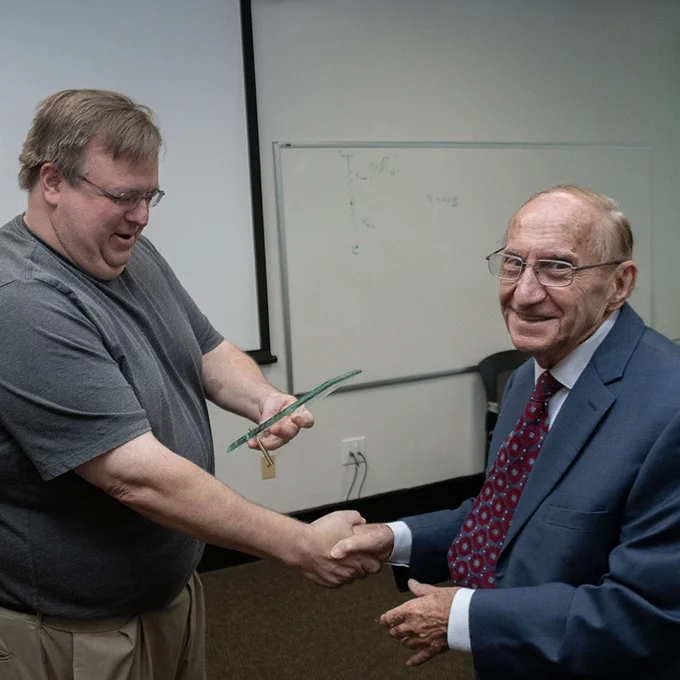 Branko Popov receiving an award from Chemical Engineering Chair Chris Williams. 