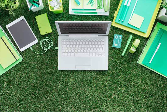 Laptop on a grass pitch. 