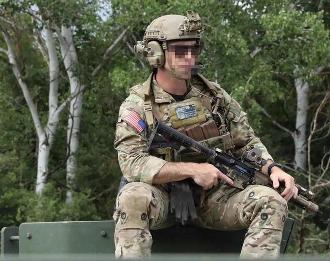 A Green Beret with U.S. Army 20th Special Forces Group (Airborne) observes his team getting into formation prior to a raid on a simulated enemy cache location during Trojan Footprint 26 near Negotino, North Macedonia, May 17, 2026. The European theater is a living laboratory where U.S. Special Operations Forces can battle test new equipment, new tactics, and new approaches alongside some of the world's SOF formations. (U.S. Army National Guard photo by Capt. Christopher Booker)