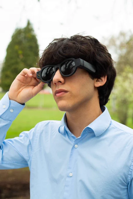 Person wearing Mavis Technologies smart glasses for blind and visually impaired users.
