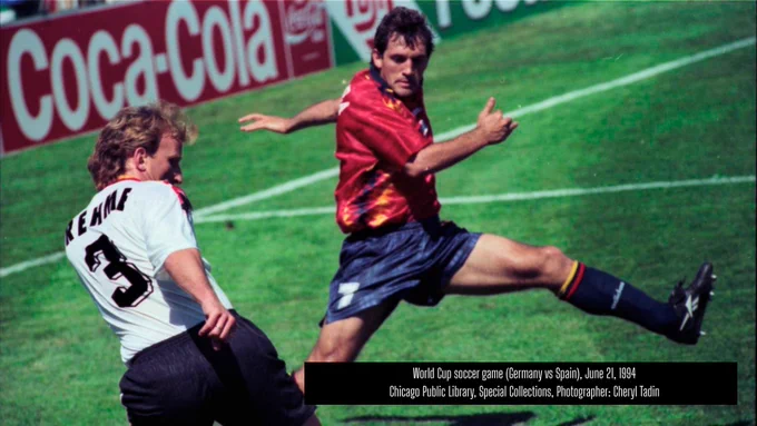 Two soccer players, one from Germany and one from Spain, on the field at the 1994 World Cup in Chicago at Soldier Field. The German player is kicking the air.