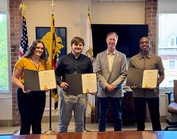 Anne Arundel County Executive Steuart Pittman poses for a photo with the Maryland Service Year interns who served in his office. 