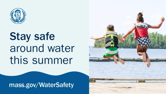 Two children wearing life jackets jump off a dock into a lake on a sunny summer day, promoting water safety awareness. Image includes the U.R.L. www.mass.gov/WaterSafety