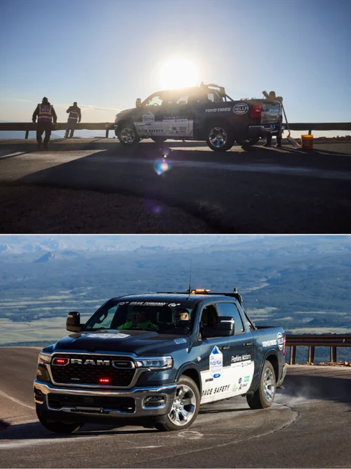 A safety truck is positioned on a mountain road during sunrise, featuring branded logos on its exterior. A scenic view and mountain backdrop add to the impactful atmosphere.