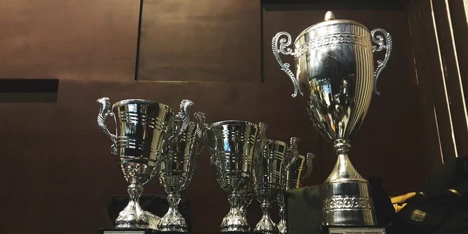 Silver cup-shaped trophies