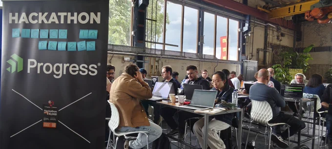 People at a conference sitting and working