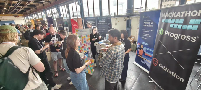 People at a conference by a booth