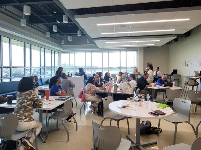 The staff group engaging in discussion.