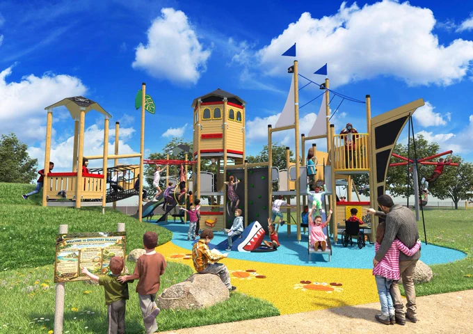 A busy children's playground with a pirate ship theme, featuring slides, climbing frames, and children playing.