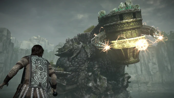 Shadow of the Colossus screenshot showing its young protagonist steeling himself as a four-legged colossus approaches.