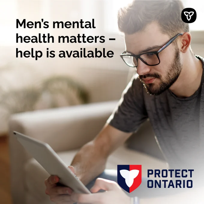 Man looking up information on his phone. Image Text: Men’s mental health matters – help is available.
