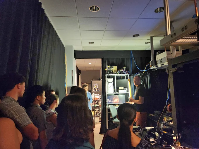 SRP interns learn about a photon microscope during a tour of the Zuckerman Institute.