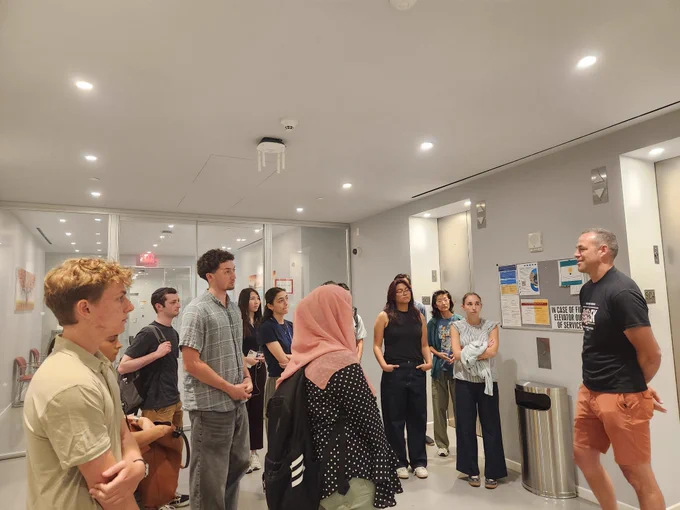 SRP interns learn about neuroscience research from Dr. Darcy Peterka during a tour of the Zuckerman Institute. 