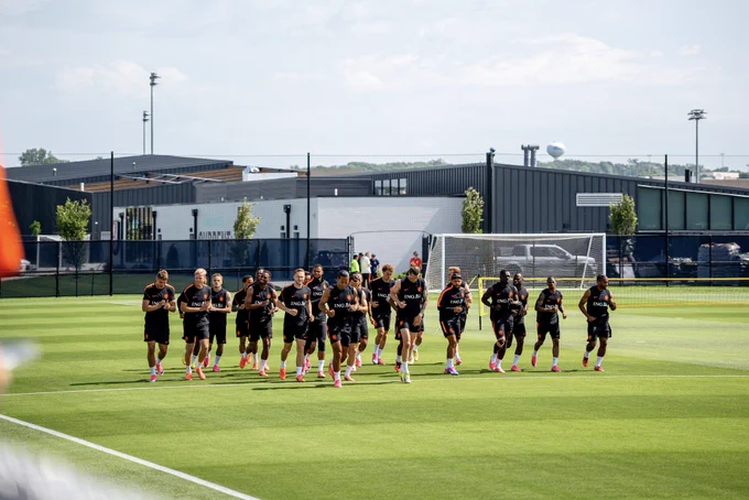 The Netherlands team running onto the pitch at Riverside Stadium for open training