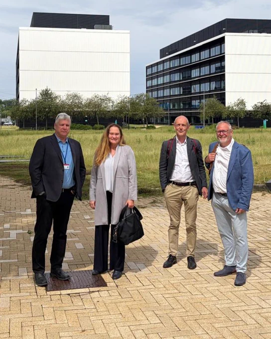 Ofer Vicus, Stefanie Steenhuis, Eric Appelman, and Jan Lemmens pose outseide the office building at Brightlands.