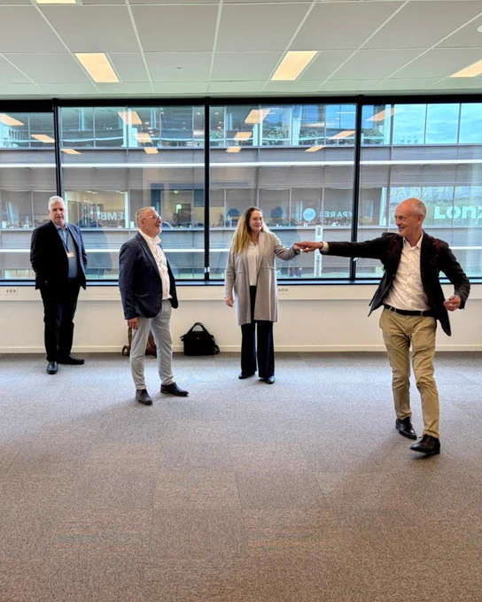 Ofer Vicus, Jan Lemmens, Stefanie Steenhuis, and Eric Appelman look around an empty office.