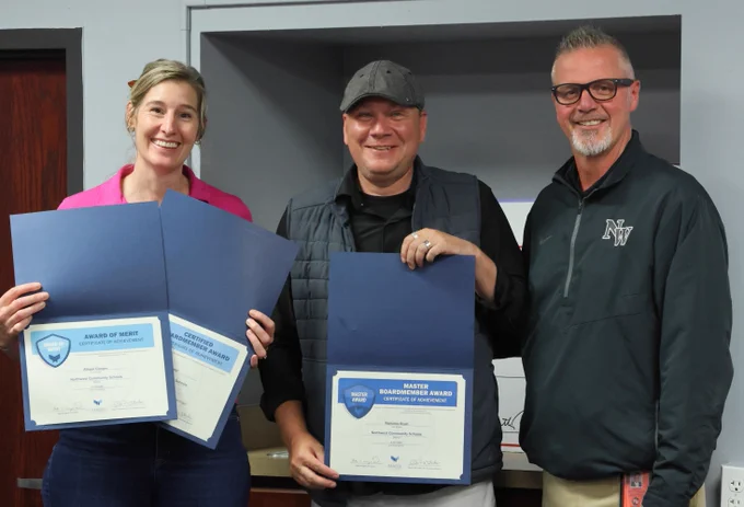 Northwest Board of Education members Nick Rush and Allison Cooper with Geoff Bontrager 