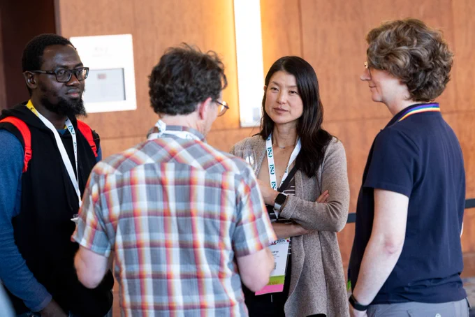 A group of ecologists discusses their science at an ESA event