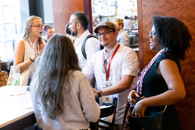 Early career ecologists share a laugh during a reception at an ESA event