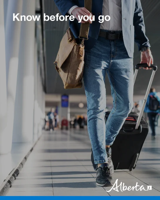 Person walking through airport pulling suitcase. Text reads: Know before you go. 
Alberta logo in bottom right corner. 