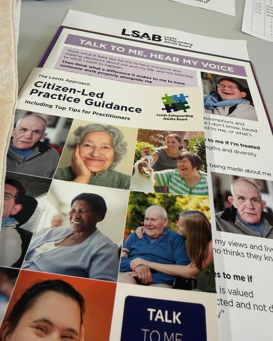 Leaflets from Leeds Safeguarding Adults Board training including Citizen-Led Practice Guidance with the slogan 'Talk to me, Hear my Voice' and photographs of a diverse group of adults of differing ages.