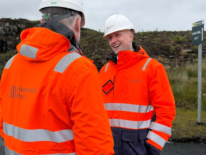 Transport Secretary Steohen Flynn smiles as he chats with Alex MacLeod, Chief Executive of the Stornoway Port Authority.