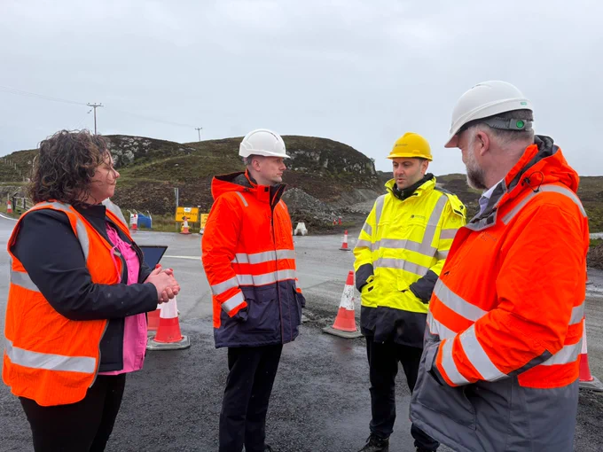 Transport Secretary talks with Port Authority staff on location at Stornoway Port.