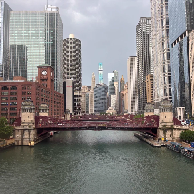 the chicago river in downtown under stormy skies