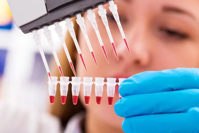 Lab worker and aliquots