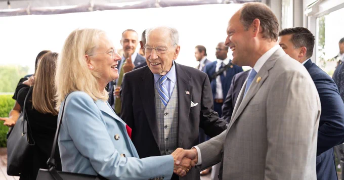 ACLI's Jill Kozeny with Senator Chuck Grassley and shaking hands with Congressman Andy Barr at the ACLI Board Reception.